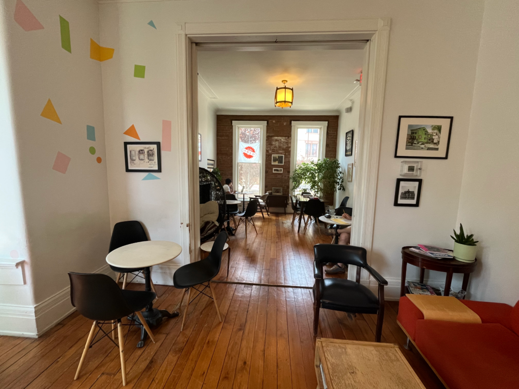 The interior seating area of Mom 'N 'Em coffee shop in Camp Washington