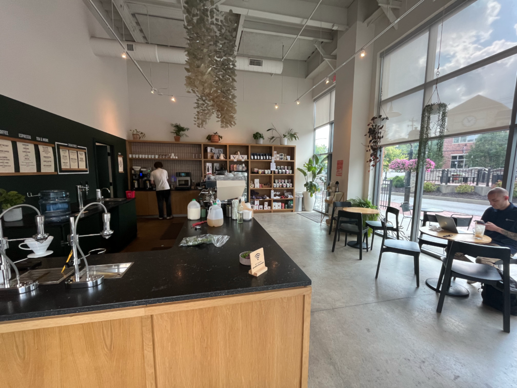 The black marble-topped ordering counter inside Deeper Roots Coffee in Montgomery
