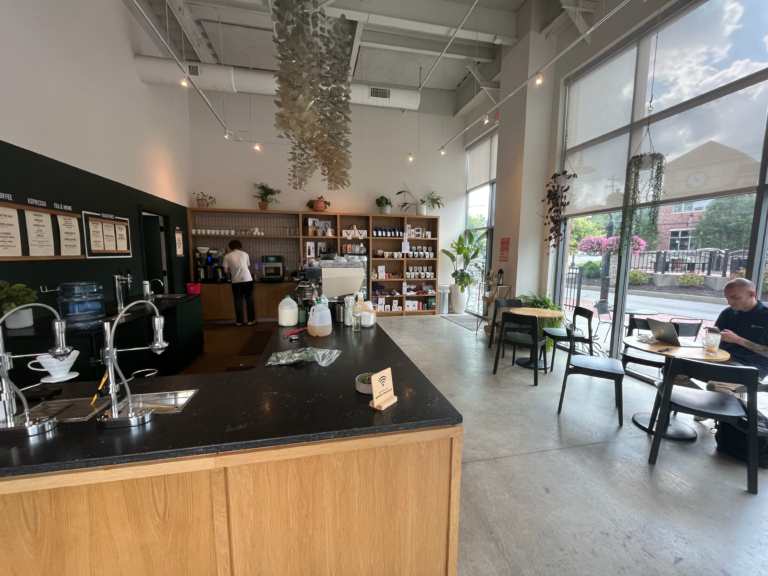 The black marble-topped ordering counter inside Deeper Roots Coffee in Montgomery